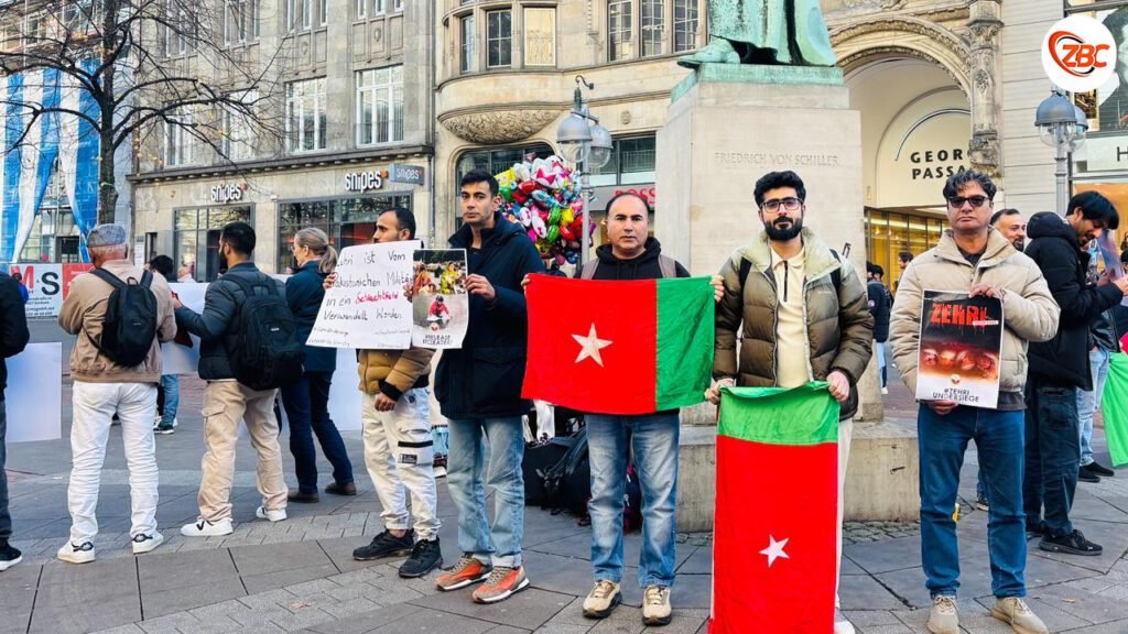 زھری ءَ ماھے ءَ گیش اِنت کہ بمبگواری کنگ بوگ ءَ اِنت جنینءُ زھگ بیران بیتگ اَنت۔ بی این ایم ءِ جرمنی ءَ زھرشانی